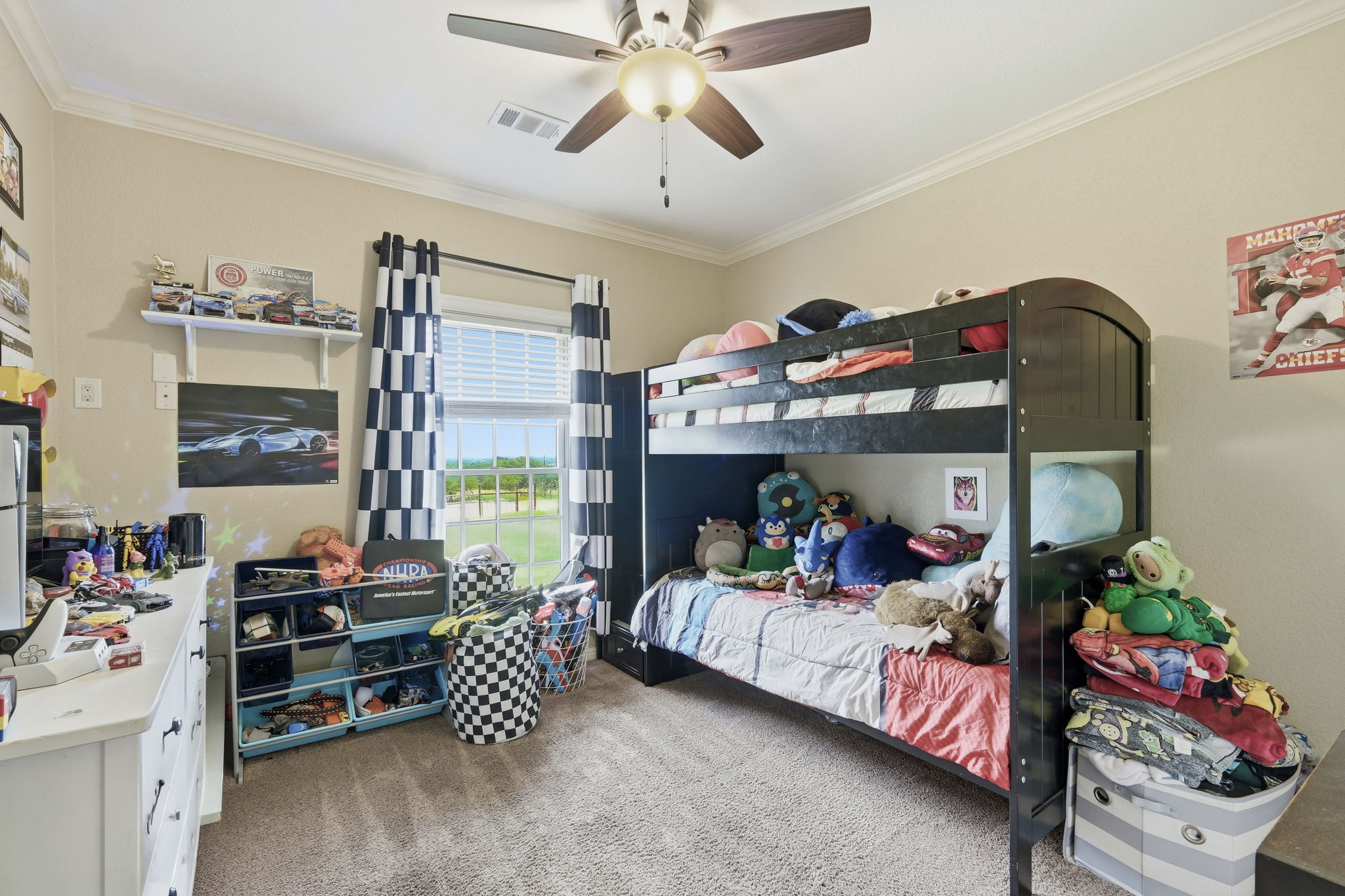 701 County Road 107 Georgetown, TX 78626 - Photo 23 of 30 a bedroom with furniture and a chandelier