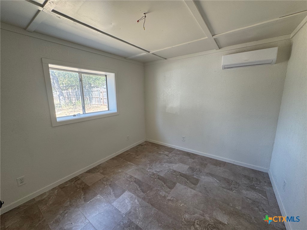 2802 West 4th Street Cameron, TX 76520 - Photo 8 of 12 a view of an empty room with a window