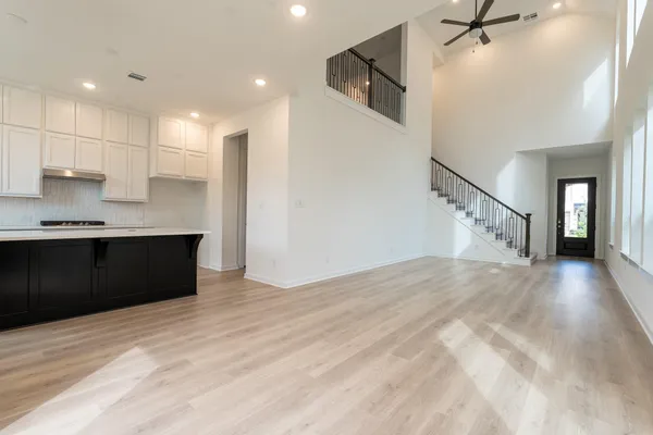 a view of a kitchen with a sink and cabinets