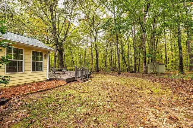 a backyard of a house with yard barbeque oven and outdoor seating