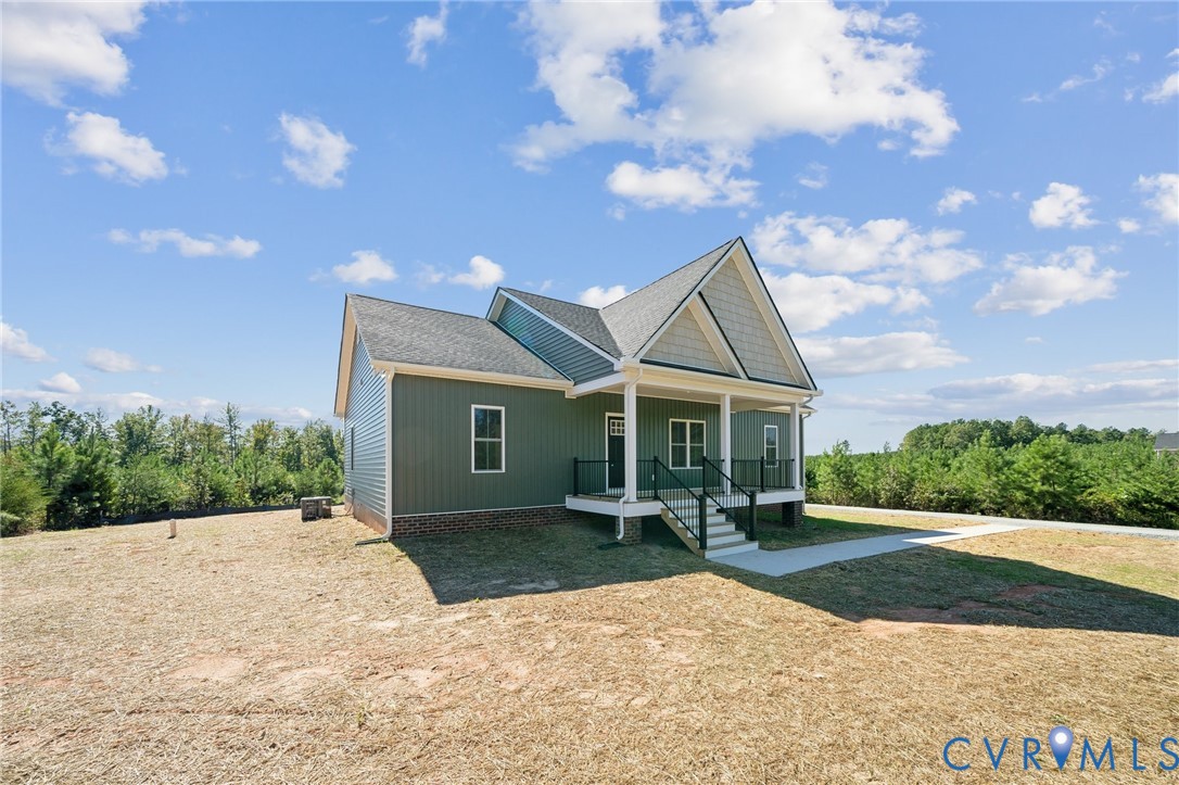 43 Oak Hill Road Cumberland, VA 23040 - Photo 2 of 34 a front view of a house with a yard and potted plants