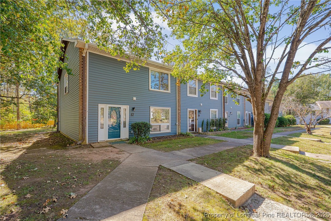 1304 Seaton Road, Unit 17 Durham, NC 27713 - Photo 1 of 32 a view of a house with a yard