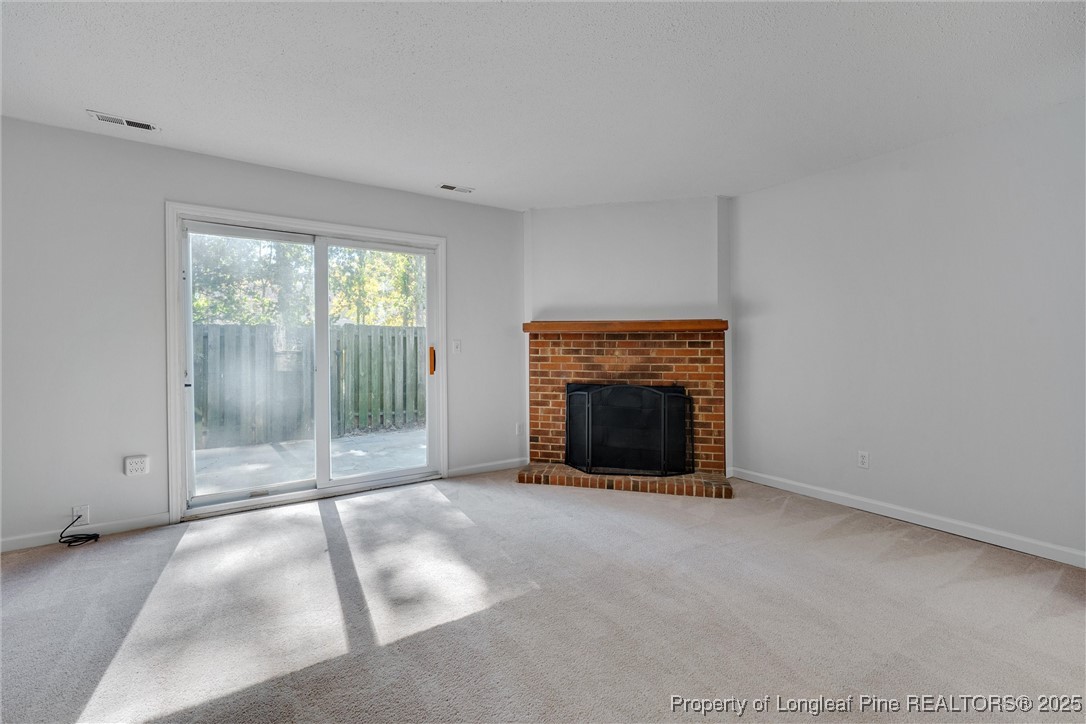 1304 Seaton Road, Unit 17 Durham, NC 27713 - Photo 13 of 32 a view of a livingroom with a fireplace