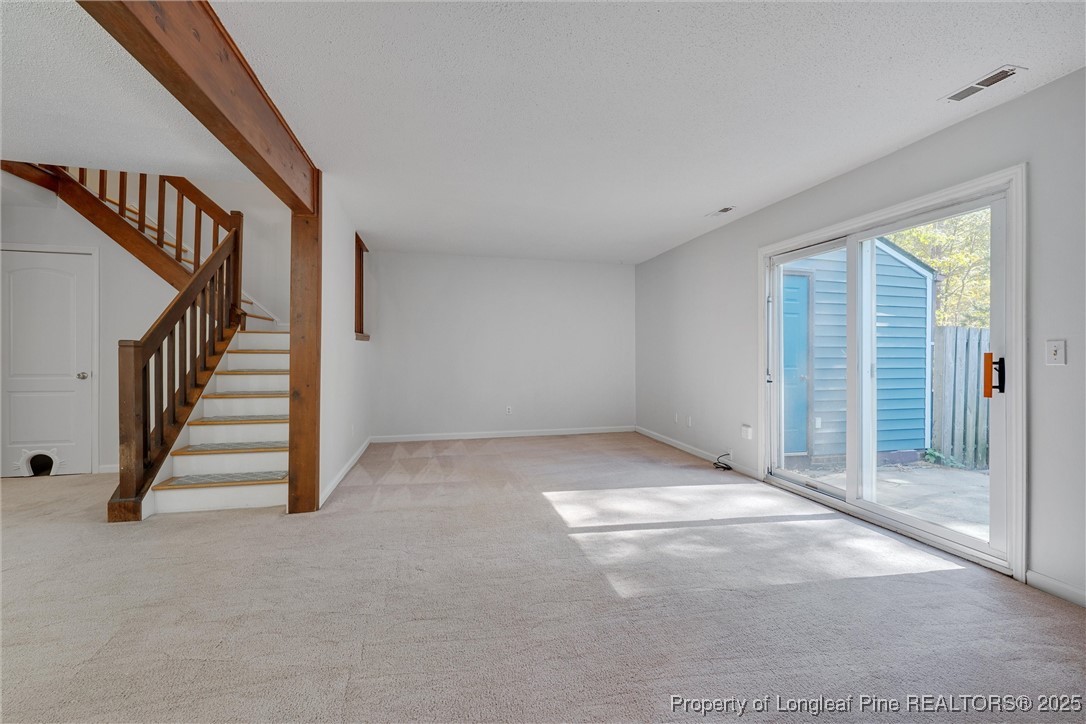 1304 Seaton Road, Unit 17 Durham, NC 27713 - Photo 15 of 32 a view of an empty room with stairs