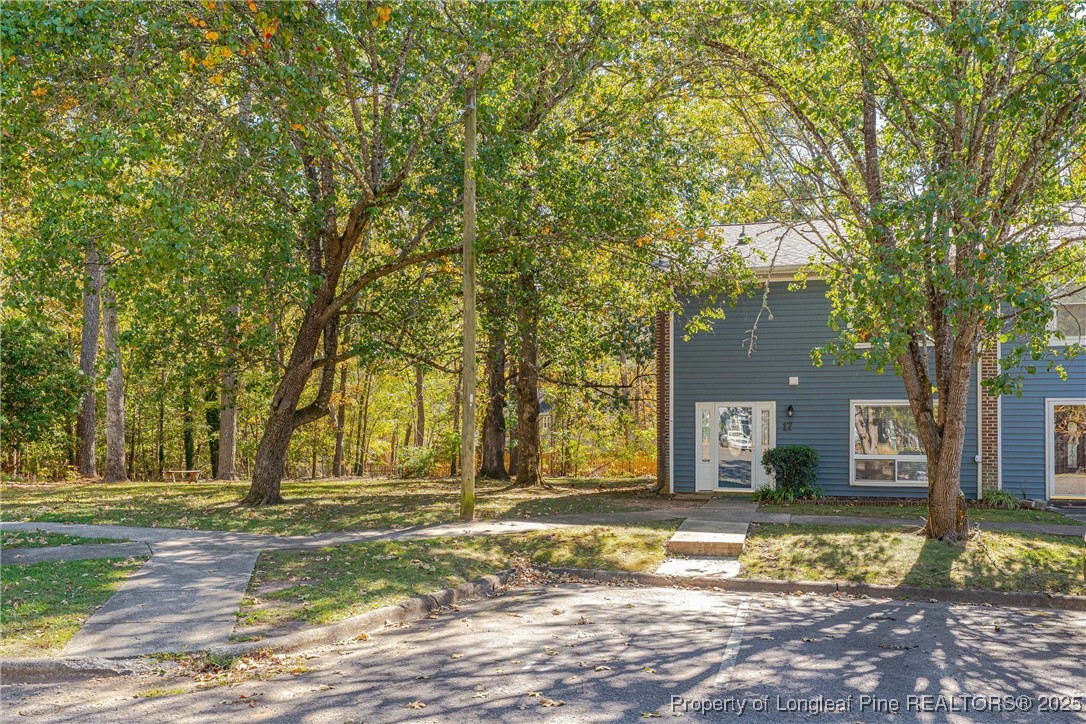 1304 Seaton Road, Unit 17 Durham, NC 27713 - Photo 2 of 32 a front view of a house with a yard