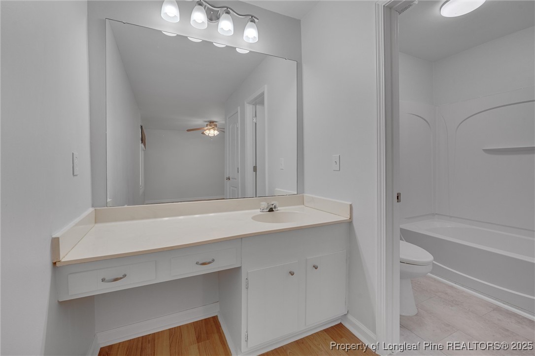 1304 Seaton Road, Unit 17 Durham, NC 27713 - Photo 24 of 32 a bathroom with a sink a large mirror and a bathtub