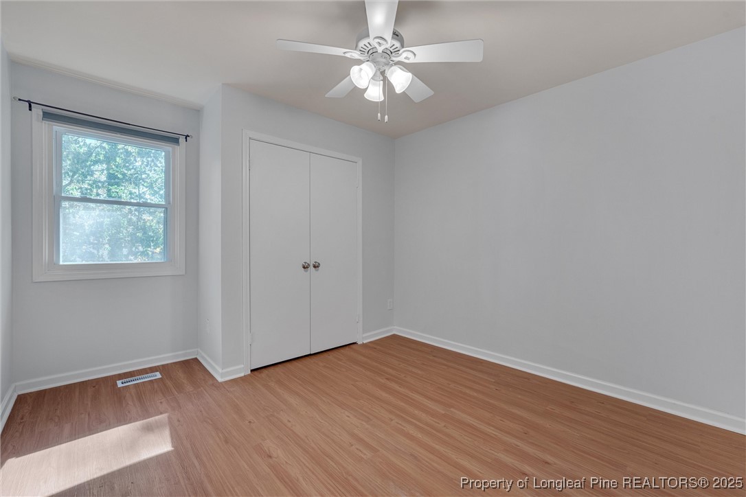 1304 Seaton Road, Unit 17 Durham, NC 27713 - Photo 29 of 32 wooden floor in an empty room with a window