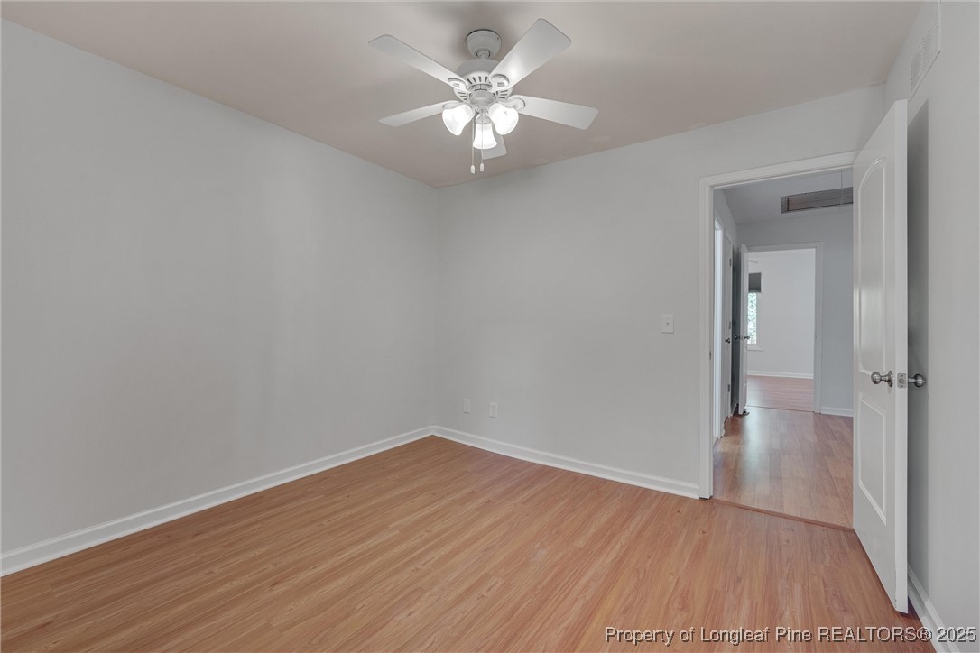 1304 Seaton Road, Unit 17 Durham, NC 27713 - Photo 30 of 32 a view of an empty room with wooden floor