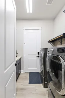 a view of a storage and utility room with washer and dryer
