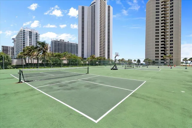 a front view of a house with yard and green space