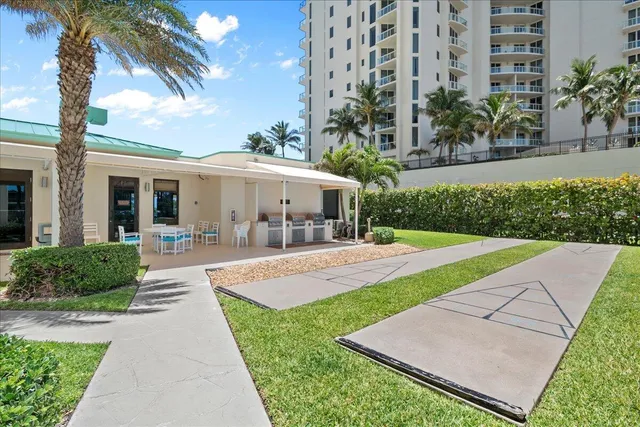 a kitchen with a stove and white cabinets