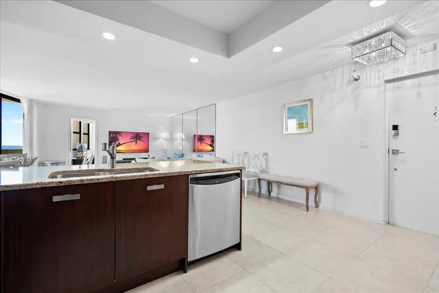 a kitchen with sink and cabinets