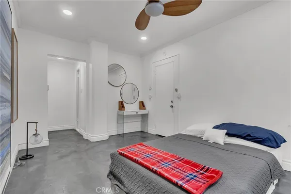 a bedroom with a bed and cabinets