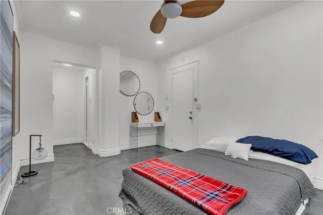 a bedroom with a bed and cabinets