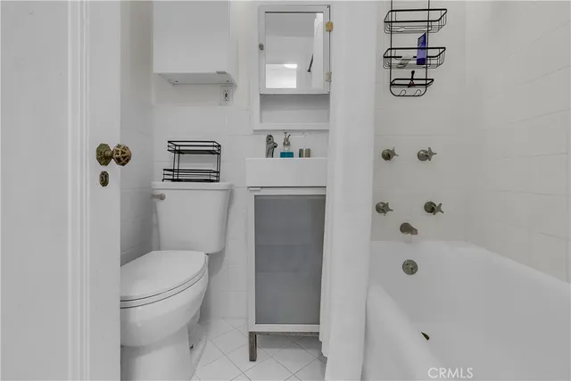 a bathroom with a toilet and shower