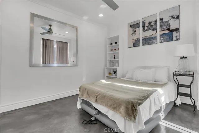 a bedroom with a bed and a cabinets