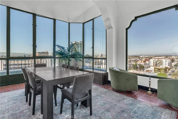 a view of a dining room with furniture and window