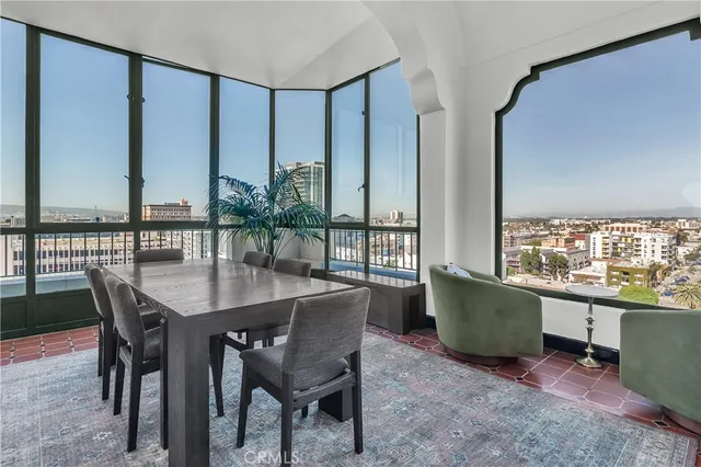 a view of a dining room with furniture and window