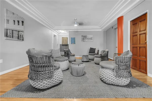 a living room with furniture and large windows