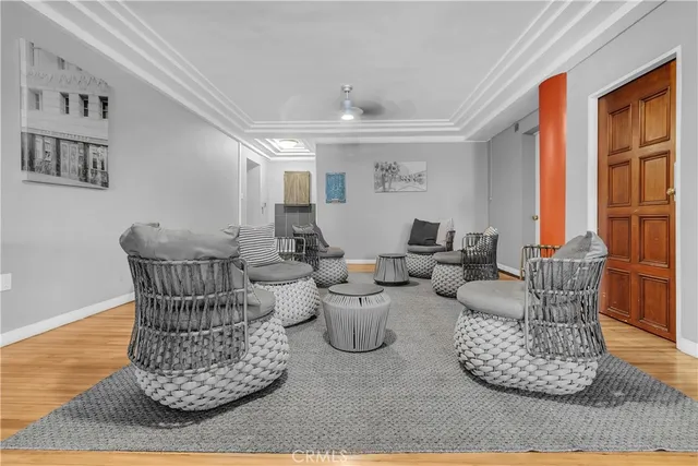 a living room with furniture and large windows