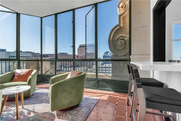 a view of a chairs and table in a patio
