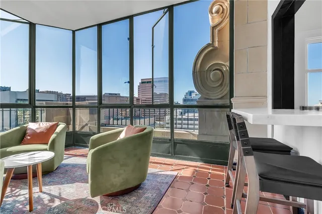 a view of a chairs and table in a patio