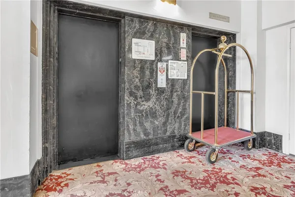 a bedroom with a table and a chair