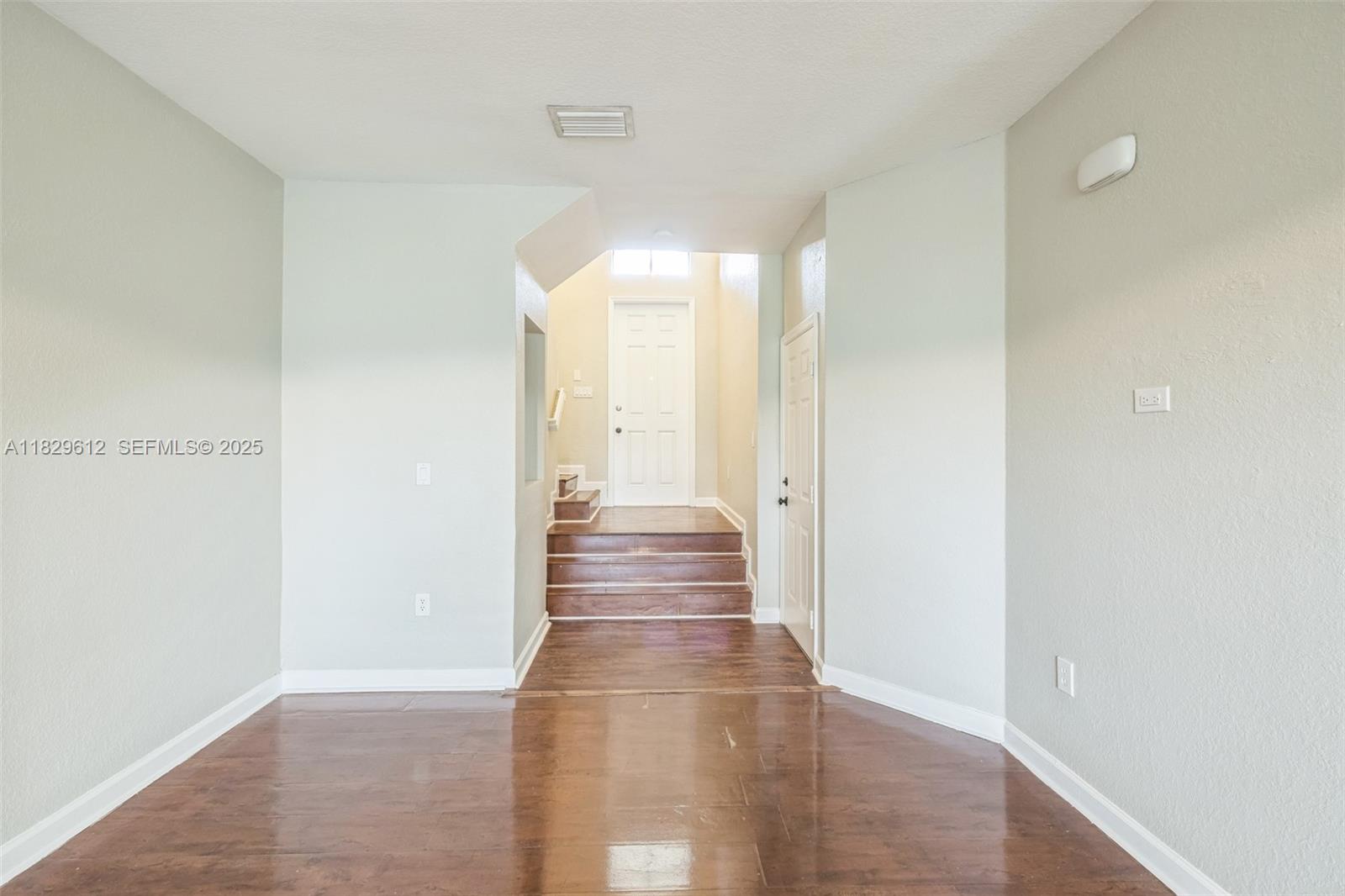 11266 Southwest 236 Lane Homestead, FL 33032 - Photo 13 of 32 a view of a hallway with wooden floor