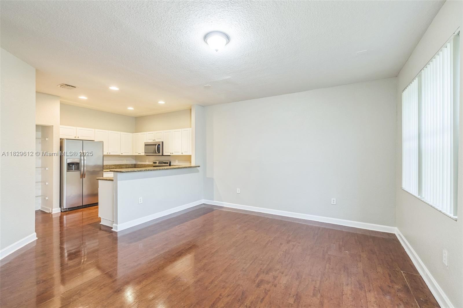 11266 Southwest 236 Lane Homestead, FL 33032 - Photo 26 of 32 a view of kitchen with wooden floor
