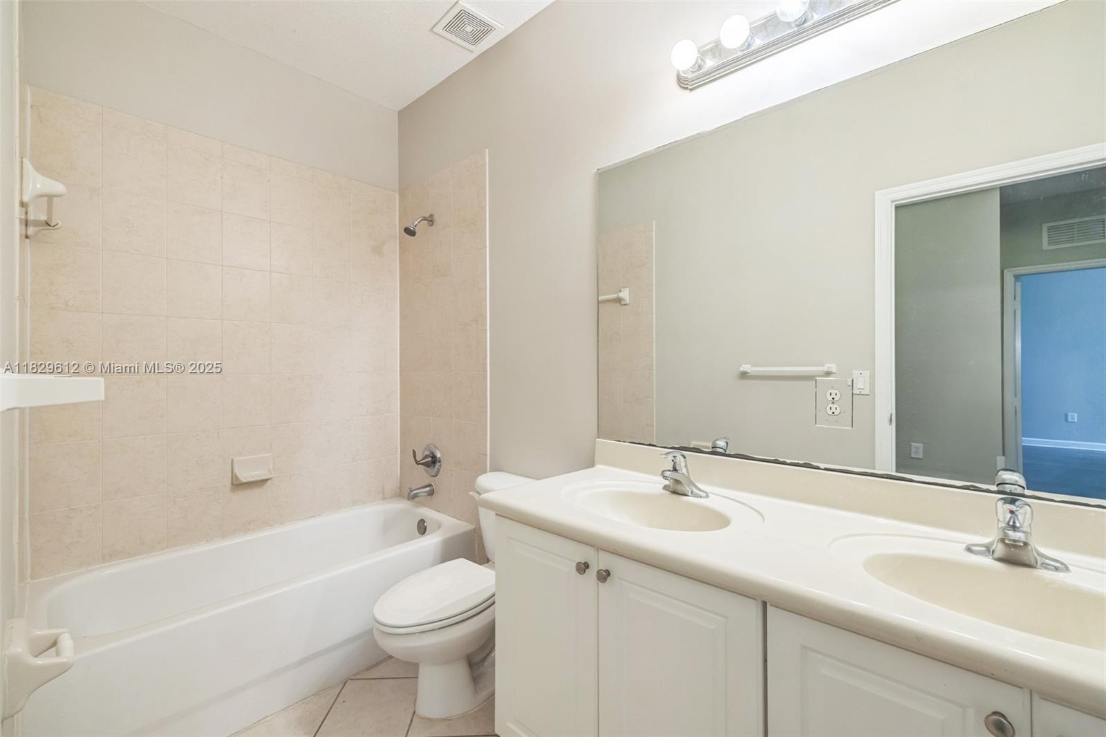 11266 Southwest 236 Lane Homestead, FL 33032 - Photo 10 of 32 a bathroom with a sink a toilet and shower