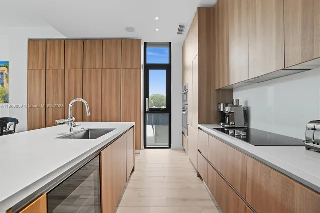 a kitchen with a sink and cabinets