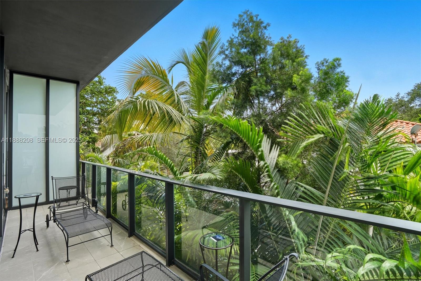 3156 Southwest 27th Avenue, Unit 203 Miami, FL 33133 - Photo 15 of 34 a view of a balcony with chairs