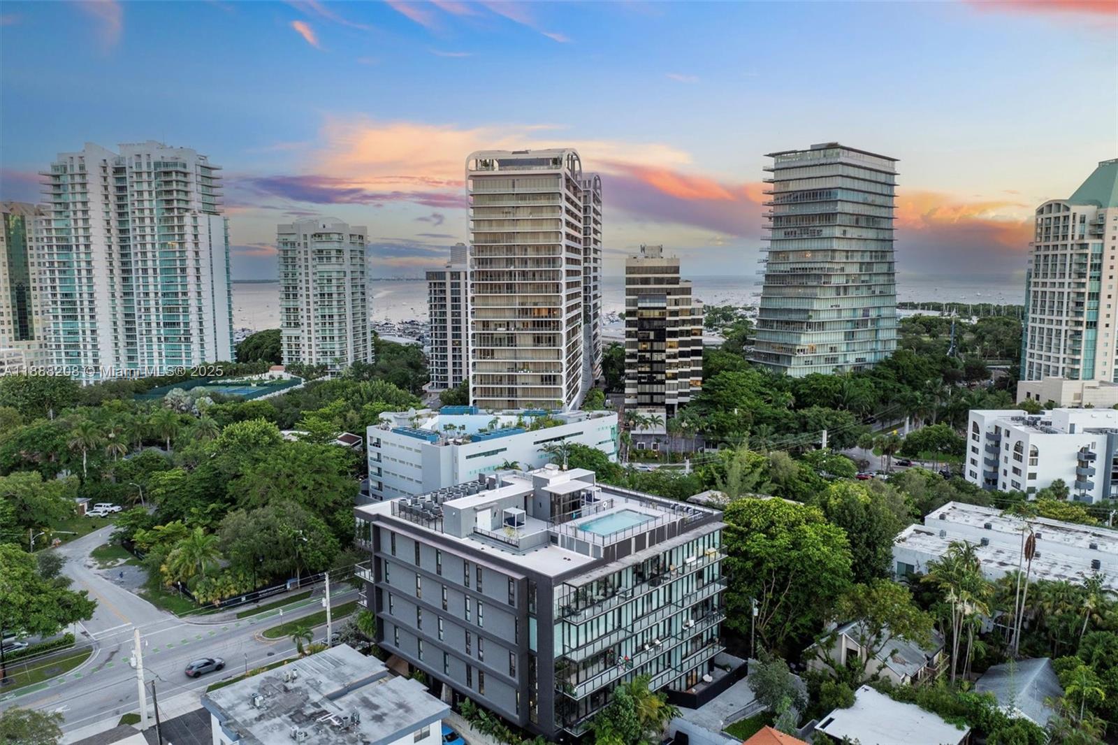 3156 Southwest 27th Avenue, Unit 203 Miami, FL 33133 - Photo 2 of 34 a view of a city with tall buildings