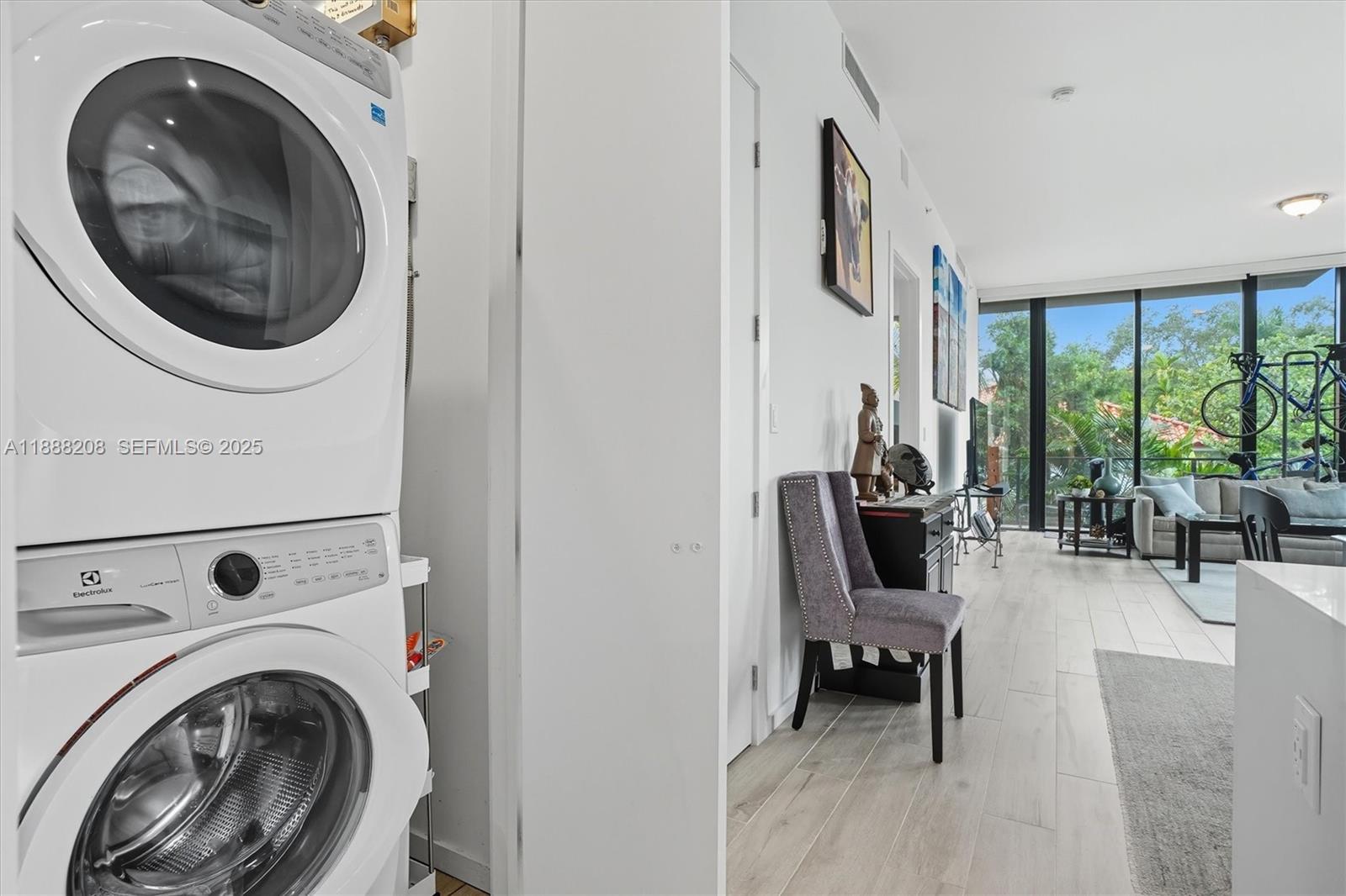 3156 Southwest 27th Avenue, Unit 203 Miami, FL 33133 - Photo 22 of 34 a view of living room washer and dryer