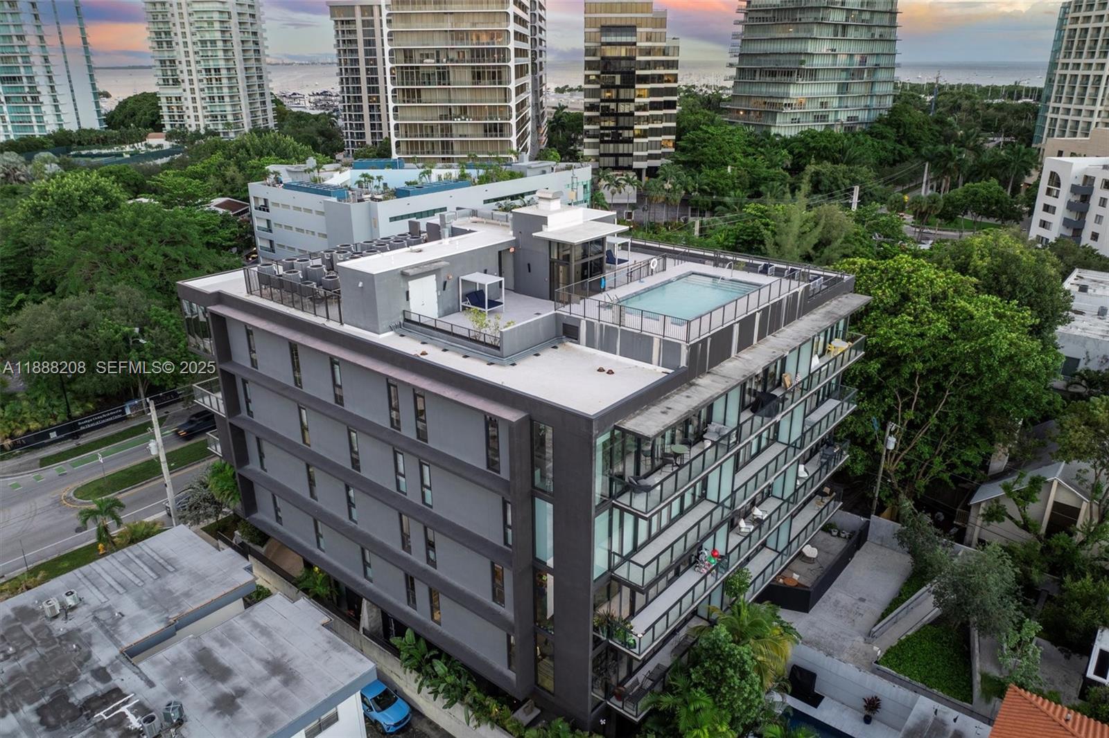 3156 Southwest 27th Avenue, Unit 203 Miami, FL 33133 - Photo 25 of 34 a view of a house with roof deck and seating space