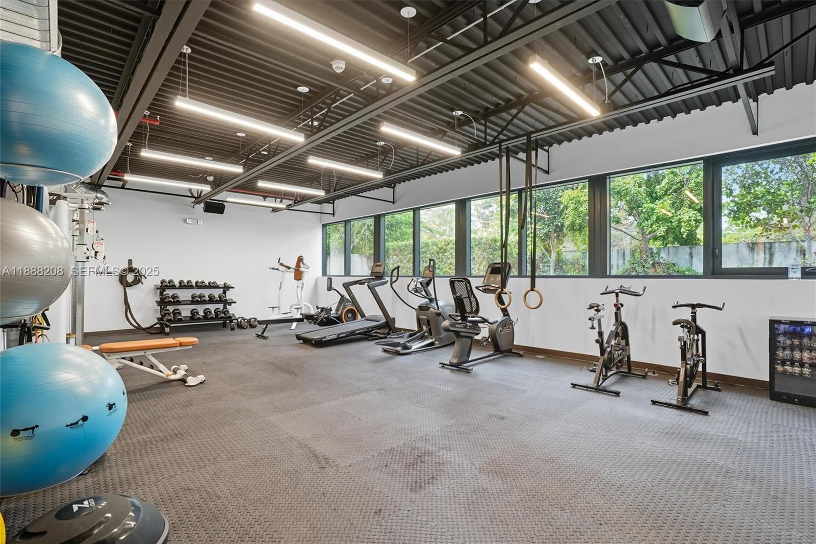 3156 Southwest 27th Avenue, Unit 203 Miami, FL 33133 - Photo 26 of 34 a view of a room with gym equipment