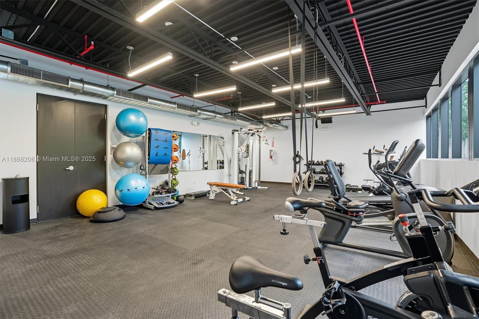 3156 Southwest 27th Avenue, Unit 203 Miami, FL 33133 - Photo 27 of 34 a view of a room with gym equipment
