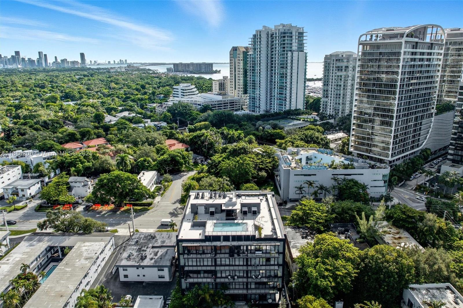 3156 Southwest 27th Avenue, Unit 203 Miami, FL 33133 - Photo 32 of 34 a view of a city with tall buildings