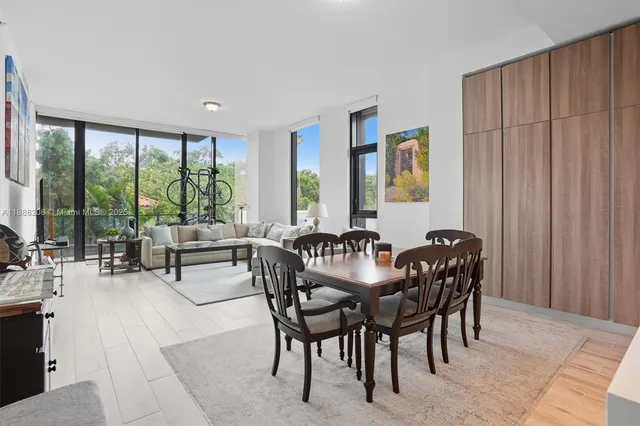 a view of a a dining room with furniture window and outside view
