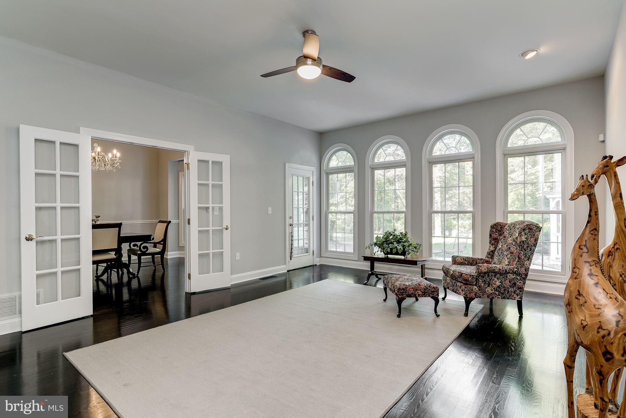 Family room off of the foyer at rear of house