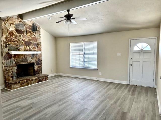 1319 Parker Road St. Paul, TX 75098 - Photo 2 of 19 wooden floor in an empty room with a fireplace