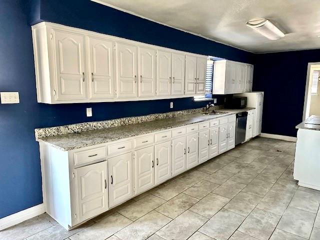 1319 Parker Road St. Paul, TX 75098 - Photo 5 of 19 a kitchen with granite countertop a sink and white cabinets