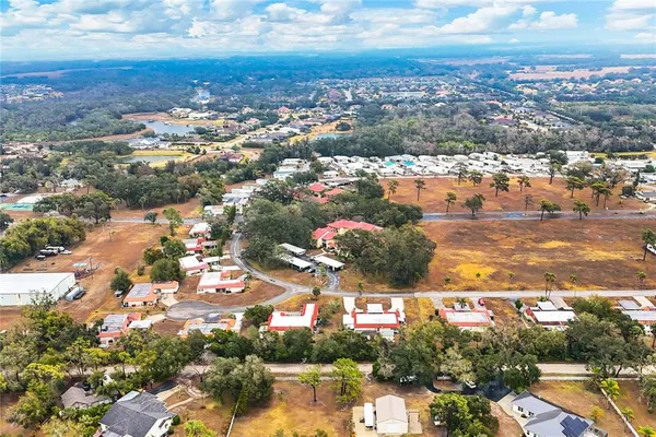 an aerial view of residential building and lake