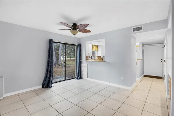 a kitchen with granite countertop white cabinets stainless steel appliances and sink