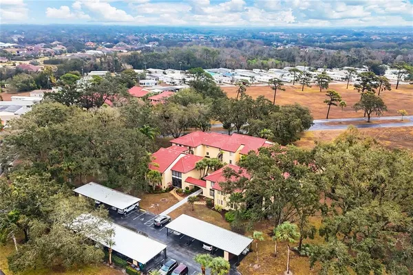 an aerial view of a houses with a swimming pool