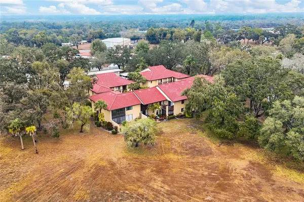 a view of a backyard with sitting area