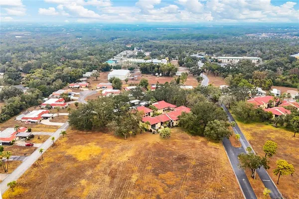 an outdoor space with swimming pool and furniture