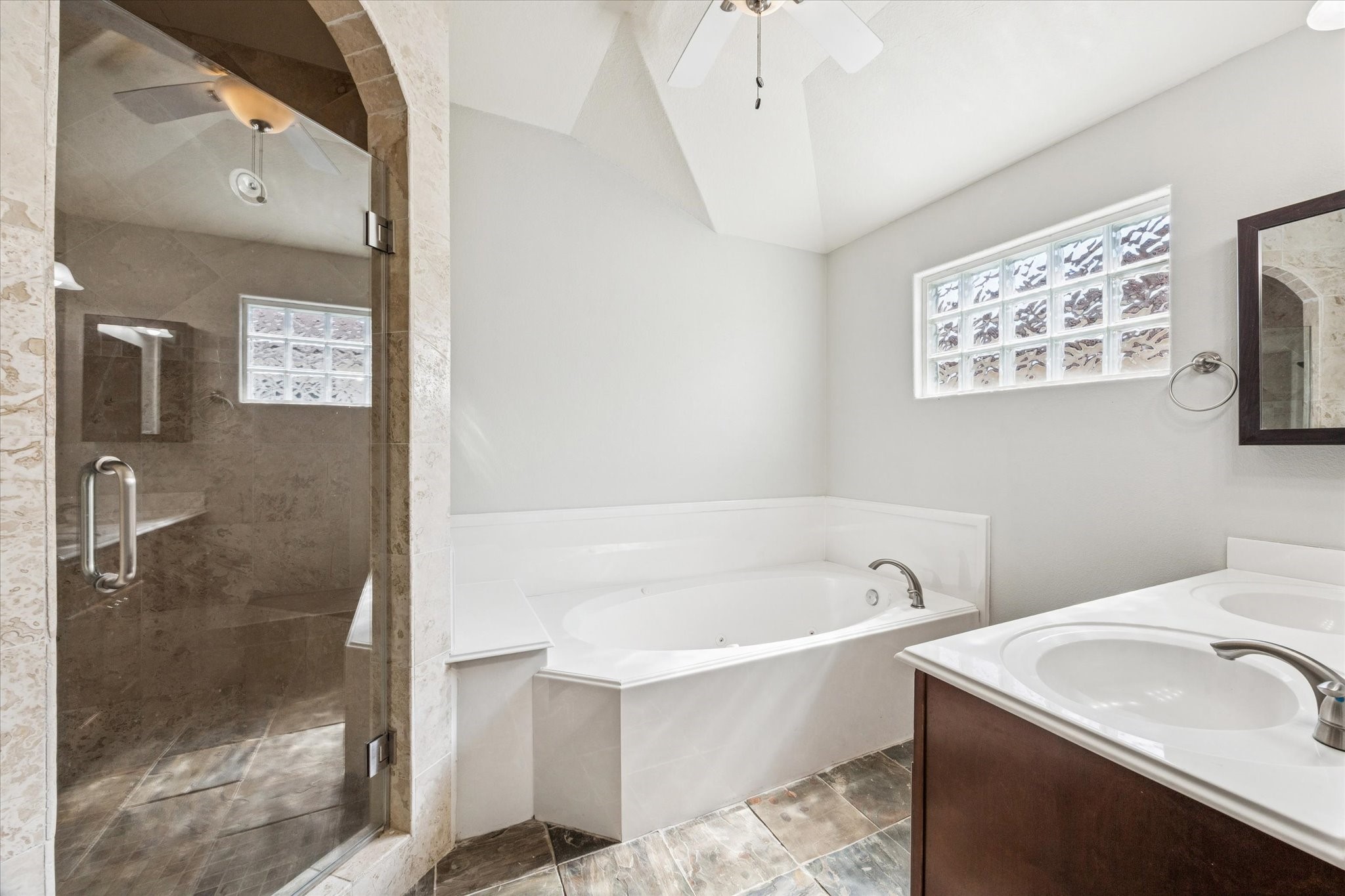 282 Debbie Lane San Leon, TX 77539 - Photo 15 of 29 a bathroom with a sink a mirror and a bathtub