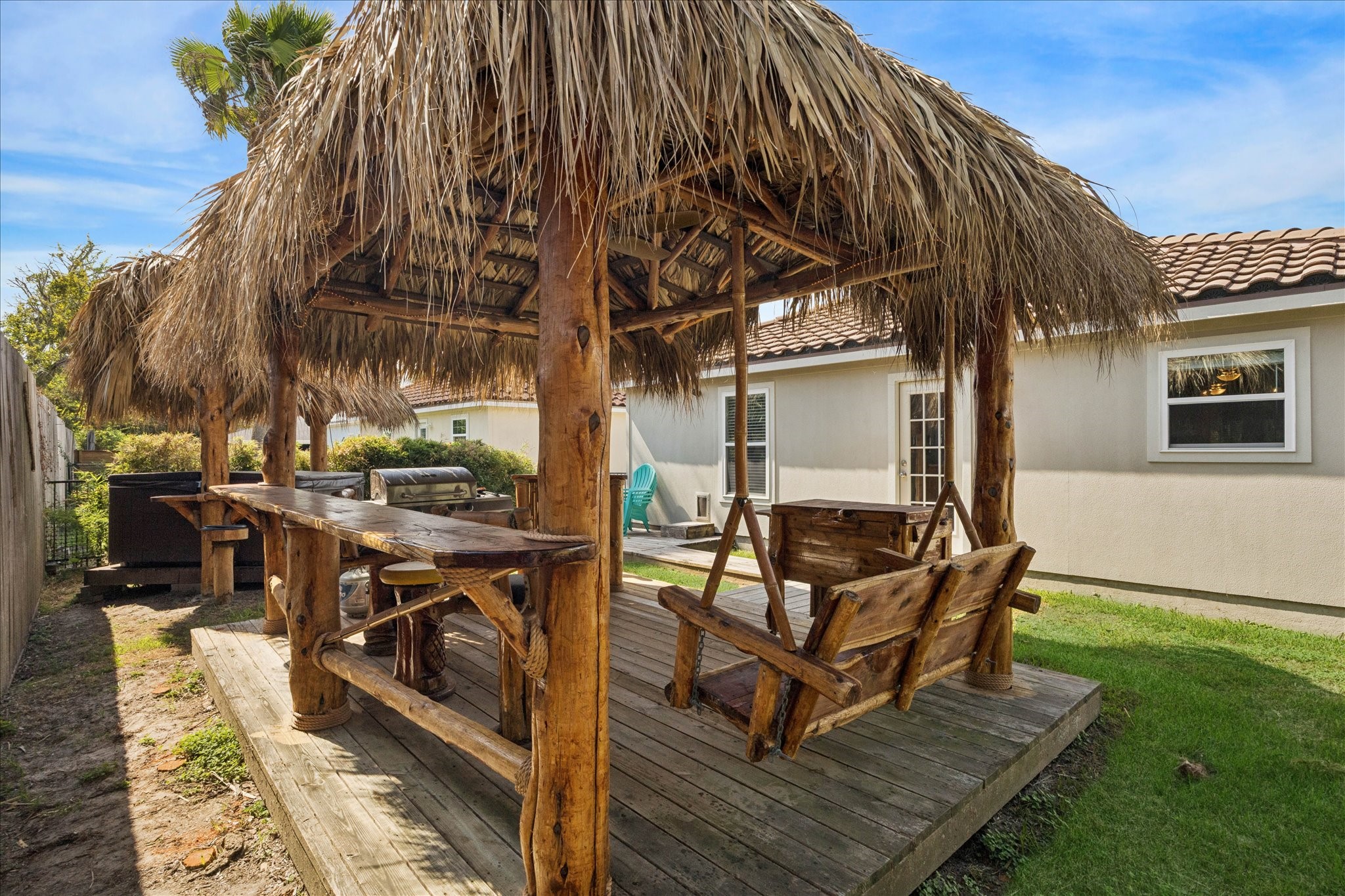 282 Debbie Lane San Leon, TX 77539 - Photo 23 of 29 a view of a chairs and table in the back yard of the house