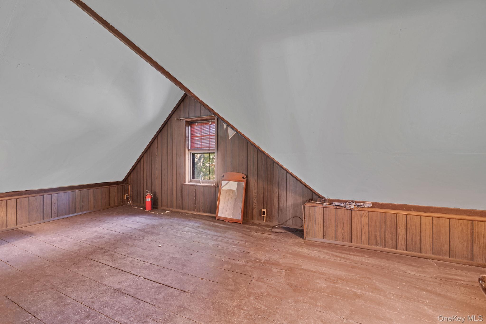 470 Little Britain Road Newburgh, NY 12550 - Photo 34 of 45 Additional living space featuring wooden walls and vaulted ceiling